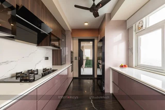 Parallel Kitchen with Pink Cabinets and Marble Backsplash