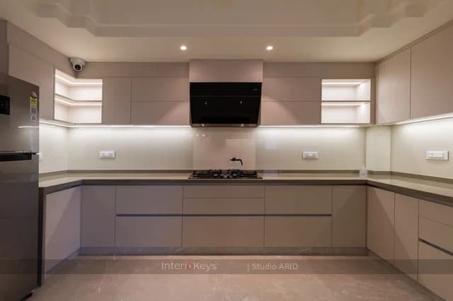 U-Shaped Kitchen with Handleless Beige Cabinets