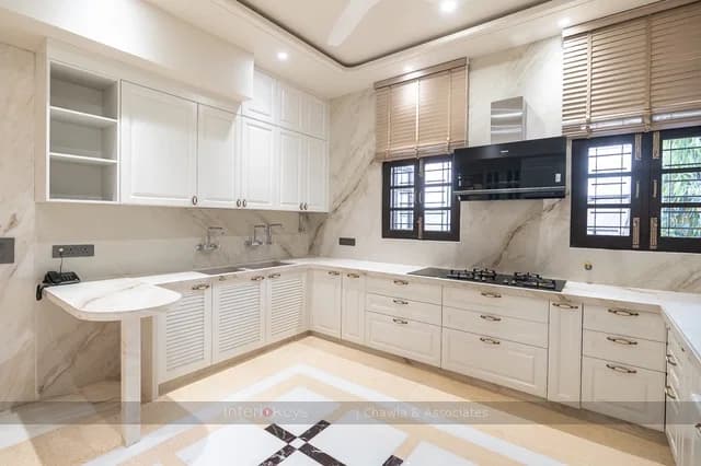 U-Shaped Kitchen in White with Marble Counters