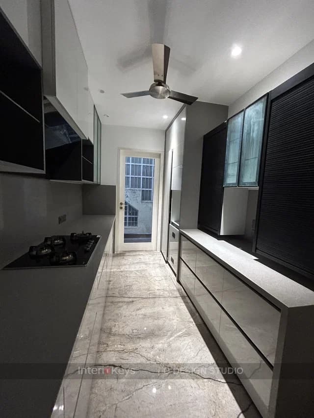 Parallel Kitchen with Glossy Handleless Cabinets