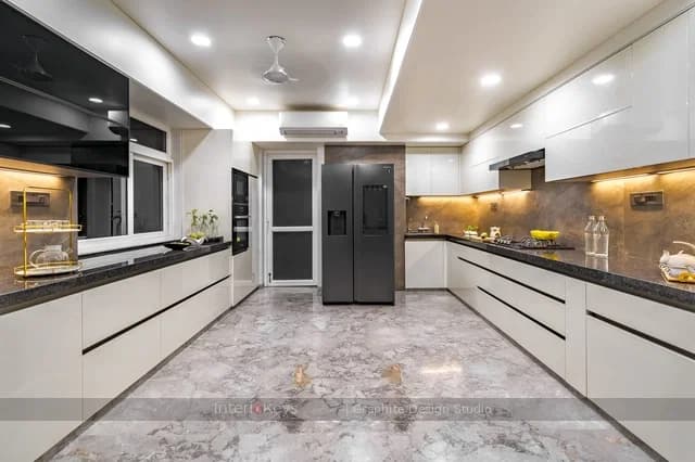 Kitchen with Handleless White Cabinets & Granite