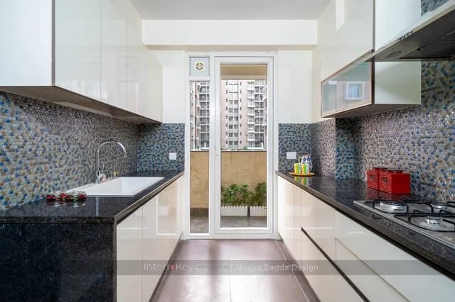 Parallel Kitchen with White Cabinets and Blue Mosaic Tiles