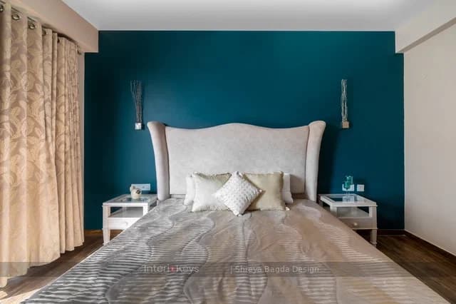 Master Bedroom with Teal Feature Wall and Wingback Bed