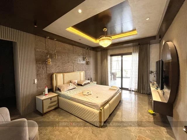 Master Bedroom with Tufted Bed and Round TV Panel