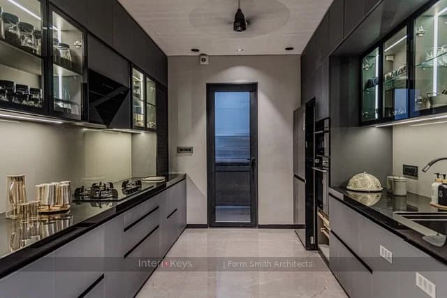 Parallel Kitchen with Grey Cabinets and Black Counters