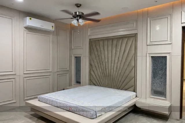Master Bedroom With Sunburst Pleated Headboard