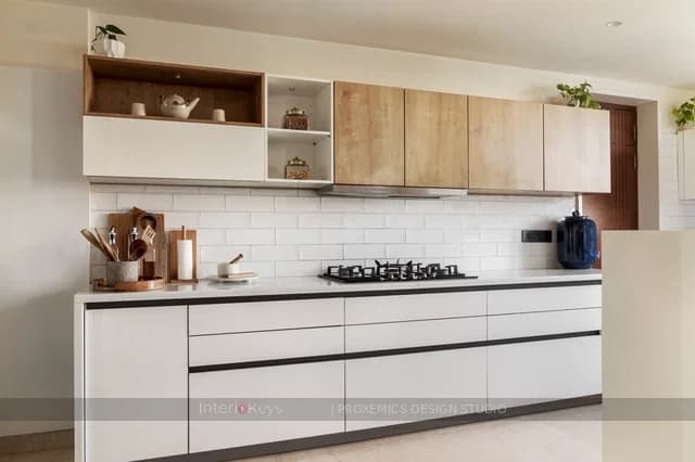 Straight Kitchen with White Cabinets and Subway Tiles