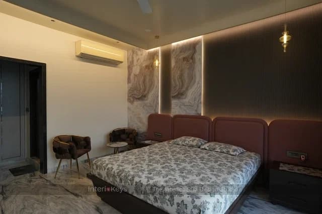 Master Bedroom with Rust Headboard and Marble Feature Wall