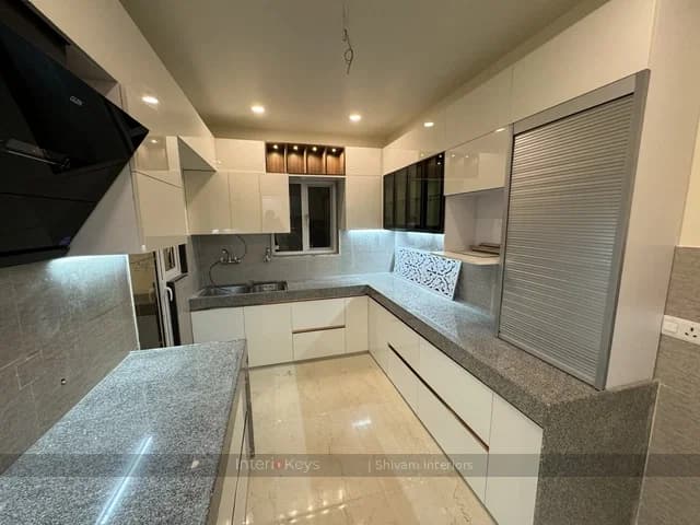 U-Shaped Kitchen with White Glossy Cabinets