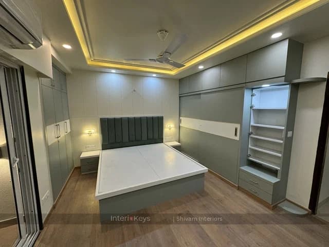 Master Bedroom with Green Headboard and Wardrobes