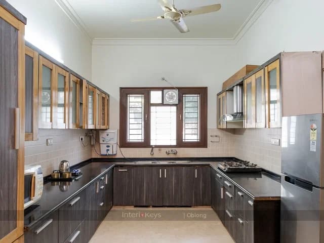 U-Shaped Kitchen with Dark Wood Cabinets