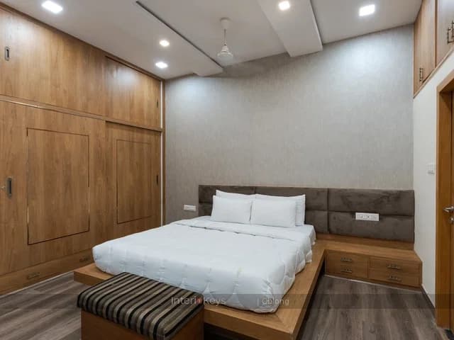 Master Bedroom with Wood-Panelled Wall and Wardrobe