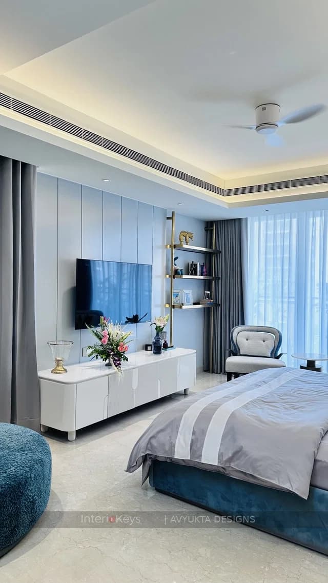 Master Bedroom with Blue Panelled Wall and TV Unit